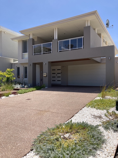 Front landscaped driveway of property