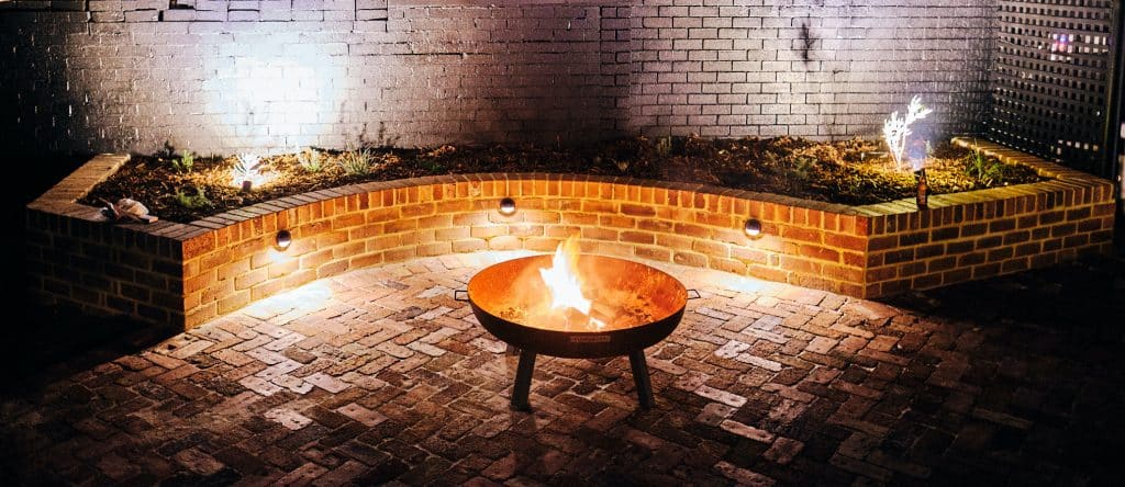 Recycled brick pad with fire pit